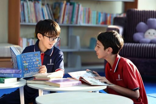 Two students enjoys reading time at school library