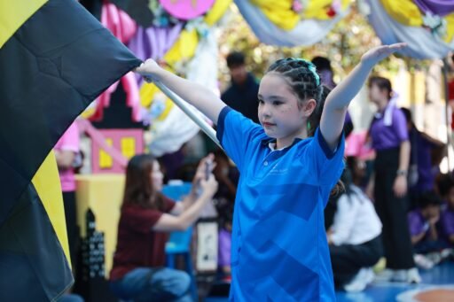 school sports day girl holding flag
